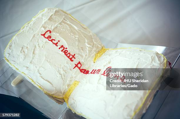 Book-shaped cake reading "Ceci n'est pas un livre" or "This is not a book" at the Johns Hopkins University's annual "Read It And Eat It" Edible Book...