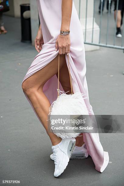 Fashion journalist Milana Koroleva wears an Isetta dress, Elie Saab bag and Nike sneakers day 4 of Paris Haute Couture Fashion Week Autumn/Winter...