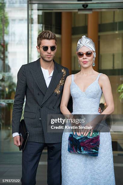 Marketing director Frol Burimskiy with Fashion designer Ulyana Sergeenko wearing an Ulyana Sergeenko dress and bag day 4 of Paris Haute Couture...