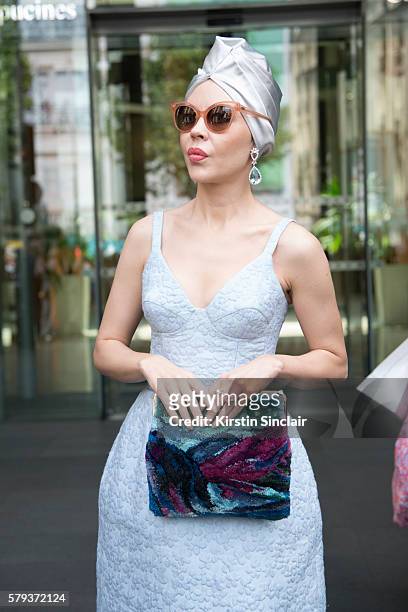 Fashion designer Ulyana Sergeenko wears an Ulyana Sergeenko dress and bag day 4 of Paris Haute Couture Fashion Week Autumn/Winter 2016, on July 6,...