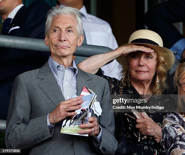 Charlie Watts and Shirley Ann Shepherd watch the racing as they attend the King George VI Weekend at Ascot Racecourse on July 23, 2016 in Ascot,...