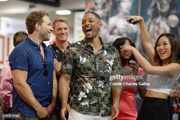 Actors Jai Courtney, Joel Kinnaman, Will Smith and Karen Fukuhara from the cast of Suicide Squad film participate in an autograph session for fans in...
