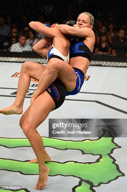 Felice Herrig attempts to submit Kailin Curran in their women's strawweight bout during the UFC Fight Night event at the United Center on July 23,...