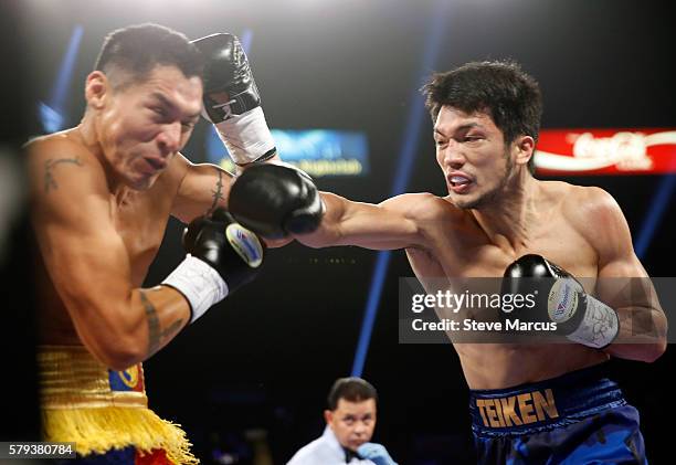 Boxer George Tahdooahnippah takes a punch from Ryota Murata of Japan during their middleweight fight at MGM Grand Garden Arena on July 23, 2016 in...