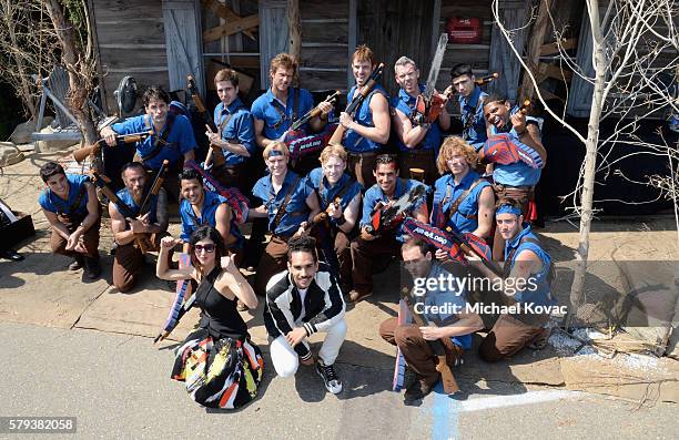 Actors Dana DeLorenzo and Ray Santiago pose with guests at the "Ash vs Evil Dead" autograph signing during Comic-Con International 2016 at PETCO Park...