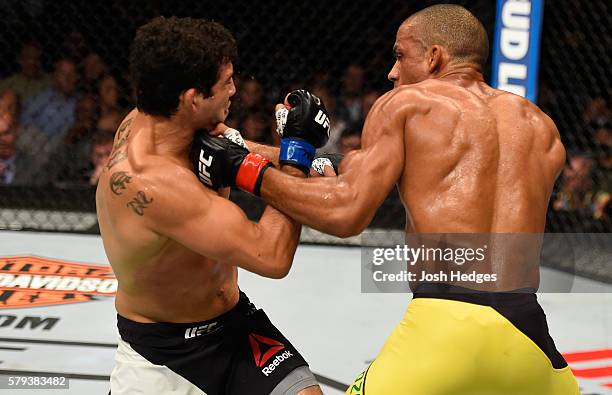 Edson Barboza of Brazil punches Gilbert Melendez in their lightweight bout during the UFC Fight Night event at the United Center on July 23, 2016 in...