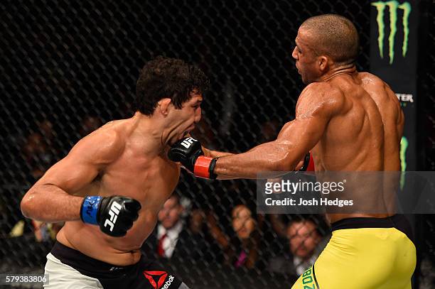Edson Barboza of Brazil punches Gilbert Melendez in their lightweight bout during the UFC Fight Night event at the United Center on July 23, 2016 in...