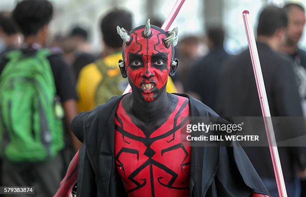 Young man plays the part of Darth Maul from Star Wars during Comic-Con International 2016 in San Diego, California, July 23, 2016. / AFP / Bill...