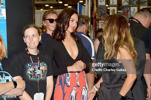 Actress Gal Gadot from the 2017 feature film Wonder Woman attend an autograph signing session for fans in DC's 2016 San Diego Comic-Con booth at San...