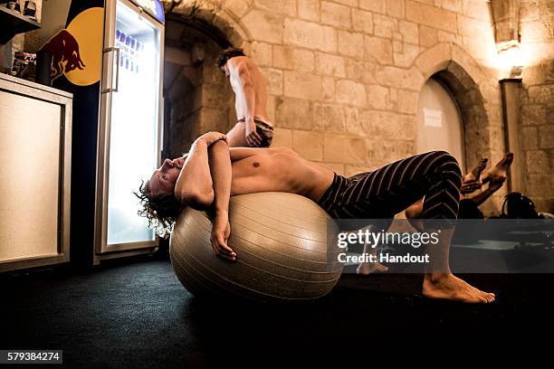 In this handout image provided by Red Bull, Kris Kolanus of Poland warms up in the athletes room of the Saint Nicolas Tower during the fourth stop of...