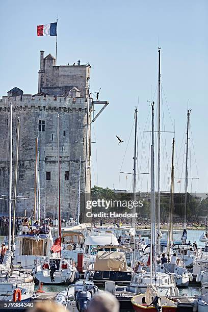 In this handout image provided by Red Bull, Kris Kolanus of Poland dives from the 27 metre platform on the Saint Nicolas Tower during the fourth stop...