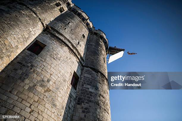 In this handout image provided by Red Bull, Andy Jones of the USA dives from the 27 metre platform on the Saint Nicolas Tower during the fourth stop...