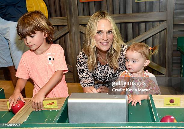 Brooks Alan Stuber, Molly Sims and Scarlett May Stuber attend The Children's Museum Of The East End 8th Annual Family Fair Fundraiser on July 23,...