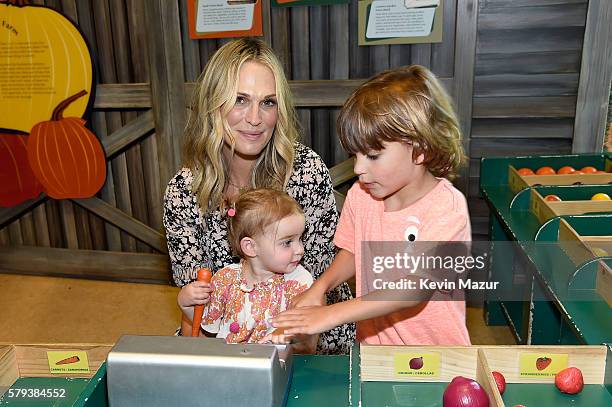 Brooks Alan Stuber, Molly Sims and Scarlett May Stuber attend The Children's Museum Of The East End 8th Annual Family Fair Fundraiser on July 23,...