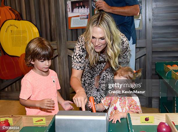 Brooks Alan Stuber, Molly Sims and Scarlett May Stuber attend The Children's Museum Of The East End 8th Annual Family Fair Fundraiser on July 23,...