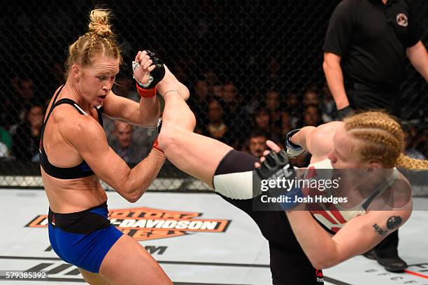 Valentina Shevchenko of Kyrgyzstan kicks Holly Holm in their women's bantamweight bout during the UFC Fight Night event at the United Center on July...