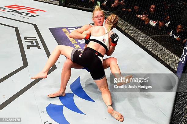 Valentina Shevchenko of Kyrgyzstan takes down Holly Holm in their women's bantamweight bout during the UFC Fight Night event at the United Center on...