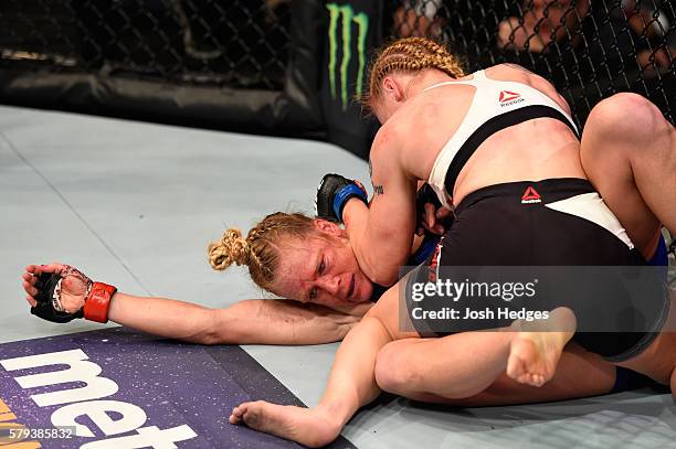 Valentina Shevchenko of Kyrgyzstan controls the body of Holly Holm in their women's bantamweight bout during the UFC Fight Night event at the United...