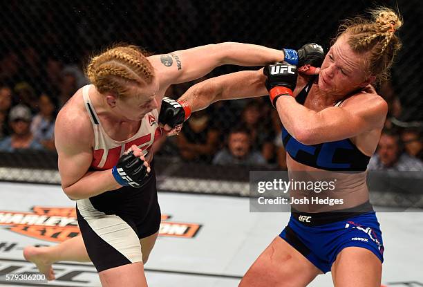 Valentina Shevchenko of Kyrgyzstan punches Holly Holm in their women's bantamweight bout during the UFC Fight Night event at the United Center on...