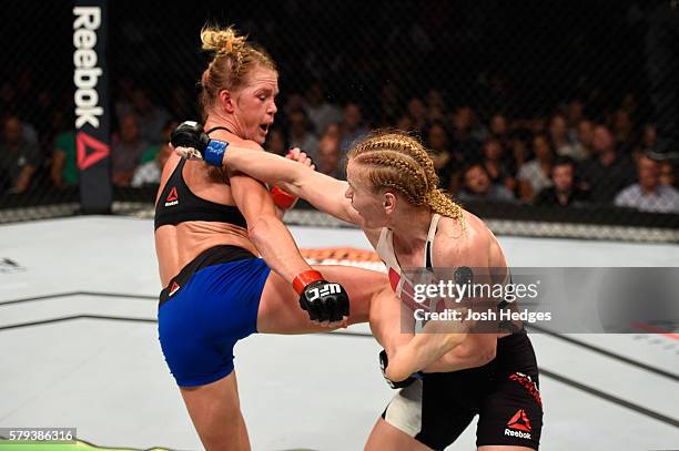 Holly Holm kicks Valentina Shevchenko of Kyrgyzstan in their women's bantamweight bout during the UFC Fight Night event at the United Center on July...