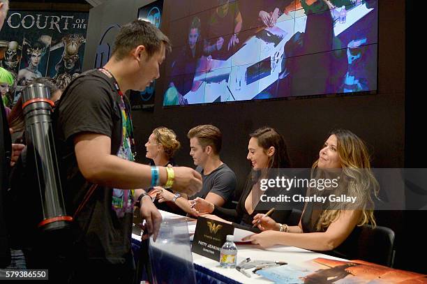 Actors Connie Nielsen, Chris Pine, Gal Gadot and director Patty Jenkins from the 2017 feature film Wonder Woman sign autographs for fans in DC's 2016...