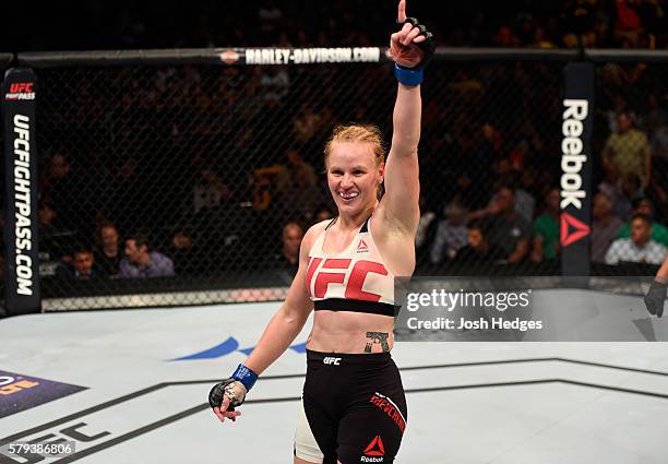 Valentina Shevchenko of Kyrgyzstan celebrates after defeating Holly Holm by unanimous decision in their women's bantamweight bout during the UFC...
