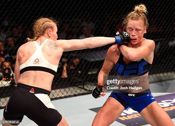 Valentina Shevchenko of Kyrgyzstan punches Holly Holm in their women's bantamweight bout during the UFC Fight Night event at the United Center on...