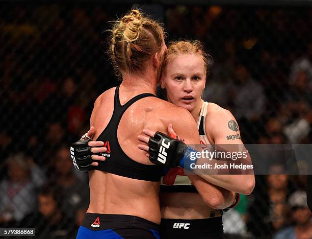 Valentina Shevchenko of Kyrgyzstan and Holly Holm embrace after finishing five rounds in their women's bantamweight bout during the UFC Fight Night...