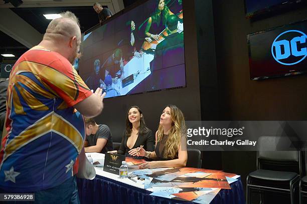 Author Andy Mangels, actress Gal Gadot and director Patty Jenkins from the 2017 feature film Wonder Woman sign autographs for fans in DC's 2016 San...