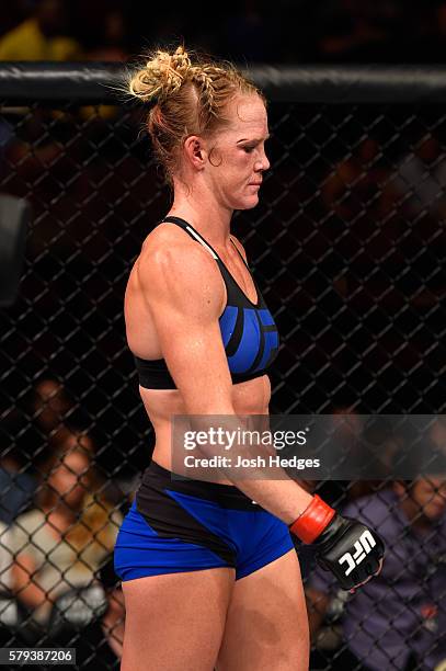 Holly Holm walks to her corner after being defeated by Valentina Shevchenko of Kyrgyzstan by unanimous decision in their women's bantamweight bout...
