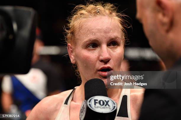 Valentina Shevchenko of Kyrgyzstan speaks with Joe Rogan after defeating Holly Holm in their women's bantamweight bout during the UFC Fight Night...