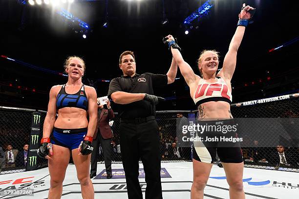 Valentina Shevchenko of Kyrgyzstan celebrates after defeating Holly Holm by unanimous decision in their women's bantamweight bout during the UFC...