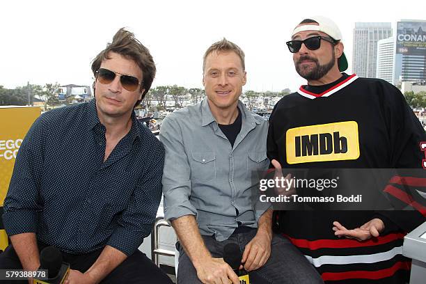 Actors Nathan Fillion ,Alan Tudyk of Con Man and host Kevin Smith attend the IMDb Yacht at San Diego Comic-Con 2016: Day Three at The IMDb Yacht on...