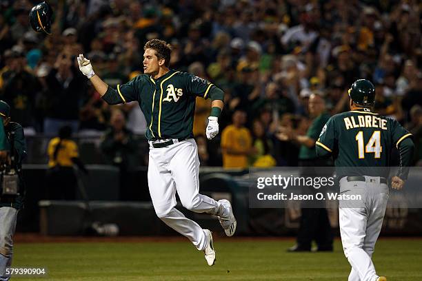 Ryon Healy of the Oakland Athletics celebrates after hitting a walk off home run against the Tampa Bay Rays during the ninth inning at the Oakland...