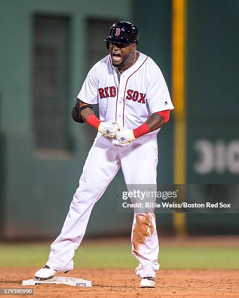 David Ortiz of the Boston Red Sox reacts after hitting an RBI double during the seventh inning of a game against the Minnesota Twins on July 23, 2016...