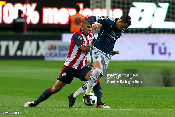 Carlos Salcido of Chivas fights for the ball with Rogelio Funes Mori of Monterrey during the 2nd round match between Chivas and Monterrey as part of...