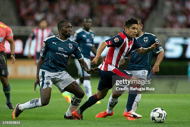 Javier Lopez of Chivas fights for the ball with Walter Ayovi of Monterrey during the 2nd round match between Chivas and Monterrey as part of the...