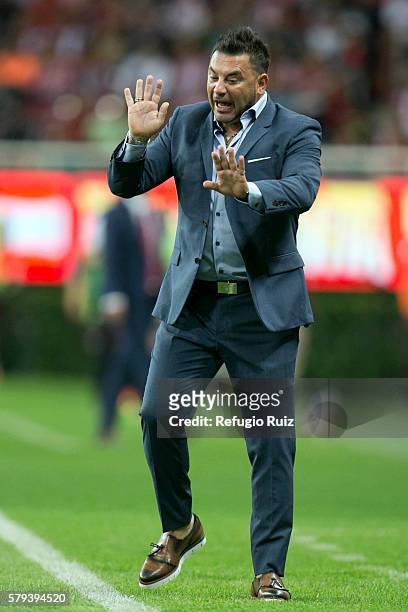 Antonio Mohamed coach of Monterrey gives instructions to his players during the 2nd round match between Chivas and Monterrey as part of the Torneo...