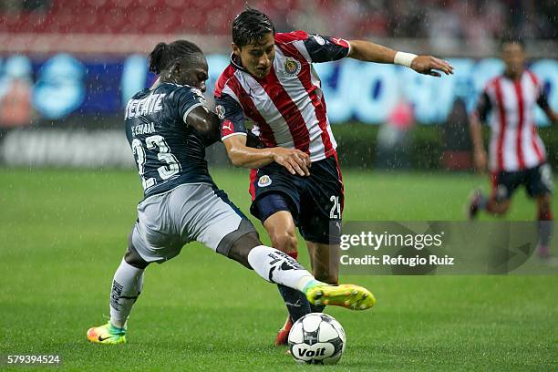 Carlos Cisneros of Chivas fights for the ball with Yimmi Chara of Monterrey during the 2nd round match between Chivas and Monterrey as part of the...
