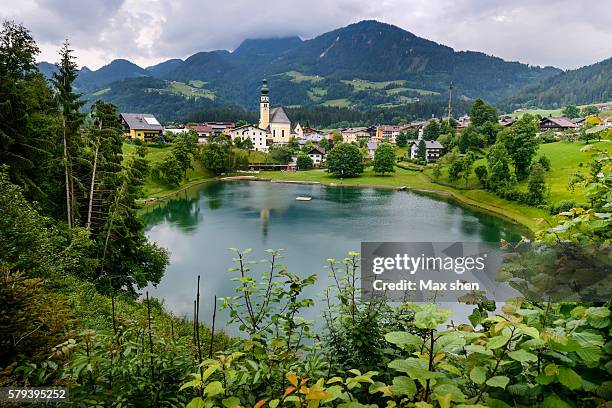 scenic view of the mountain village of alpbach in austria. - tirol austria stock pictures, royalty-free photos & images