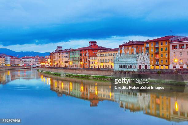 pisa with the arno river in tuscany, italy at dusk - river arno stock pictures, royalty-free photos & images