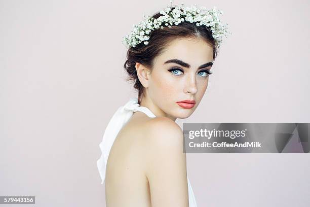 studio shot of young beautiful woman - flower tiara stock pictures, royalty-free photos & images