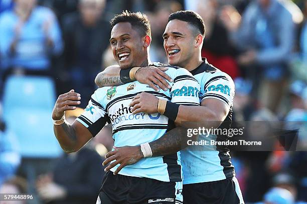 Ben Barba of the Sharks celebrates with team mate Valentine Holmes after scoring a try during the round 20 NRL match between the Cronulla Sharks and...