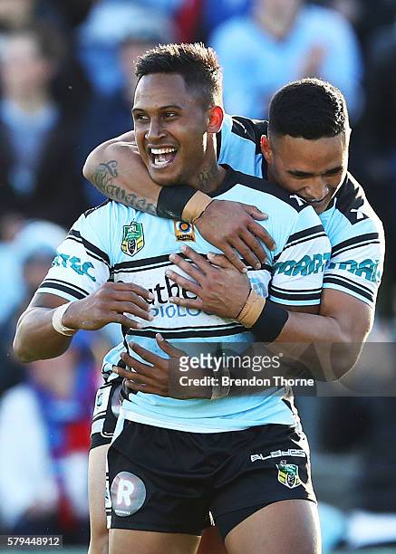 Ben Barba of the Sharks celebrates with team mate Valentine Holmes after scoring a try during the round 20 NRL match between the Cronulla Sharks and...