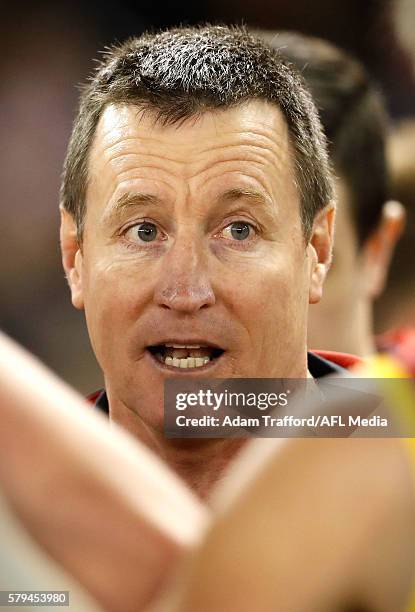 John Worsfold, Senior Coach of the Bombers addresses his players during the 2016 AFL Round 18 match between the Essendon Bombers and the Brisbane...