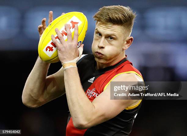 Jayden Laverde of the Bombers marks the ball during the 2016 AFL Round 18 match between the Essendon Bombers and the Brisbane Lions at Etihad Stadium...