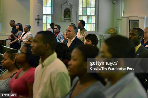 Tim Kaine, C, and his wife Anne Holton are long-time members of the predominantly African American St. Elizabeth Catholic Church on Sunday, September...