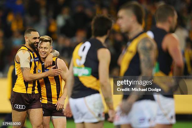 Sam Mitchell of the Hawks is hugged by Shaun Burgoyne after winning his 300th match during the round 18 AFL match between the Hawthorn Hawks and the...