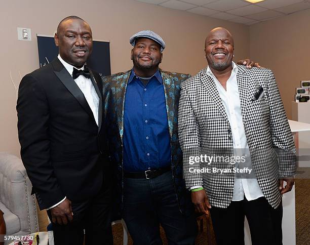 Attorney Benjamin Crump, actor/comedian Lavell Crawford and comedian Earthquake pose backstage during the 2016 Neighborhood Awards hosted by Steve...