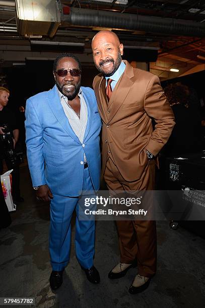 Singer Eddie Levert of The O'Jays and Neighborhood Awards Executive Producer Rushion McDonald pose backstage during the 2016 Neighborhood Awards...